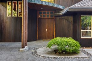 Japanese fern maple gracing the entry doors