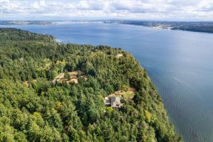 Overhead view of the surrounding area, Puget Sound and Tacoma. The property sits about 300 feet west of Pohl Road, a portion visible to the left in this image. A mere mile to the Vashon ferry dock.