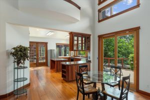 Kitchen and dining area with sliding glass door onto deck and patio