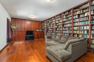 The media room has a wall of adjustable shelves for videos, books, games or displays of any sort, with cabinets and space for TV and media center at the far end. Plenty of room for couches, chairs, tables or activities. This room would also make a great main floor office – a door could even be installed in the outer wall for a private entrance.