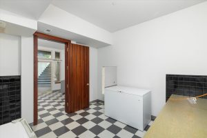 The former dark room is located directly across the main area facing the stairway up to the patio.