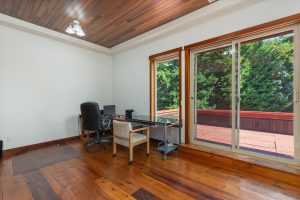 Back bedroom/office facing upper outside deck, which overlooks the garden, south lawn and Puget Sound toward Point Defiance Park