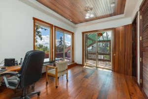 The last upstairs bedroom, used as office space, has a sliding door onto the inside deck overlooking the solarium. This is the owners’ favorite place to retreat during the colder months. Another sliding door leads to the private outside deck, which overlooks the garden, lower lawn, orchard and Puget Sound facing toward Pt. Defiance Park.
